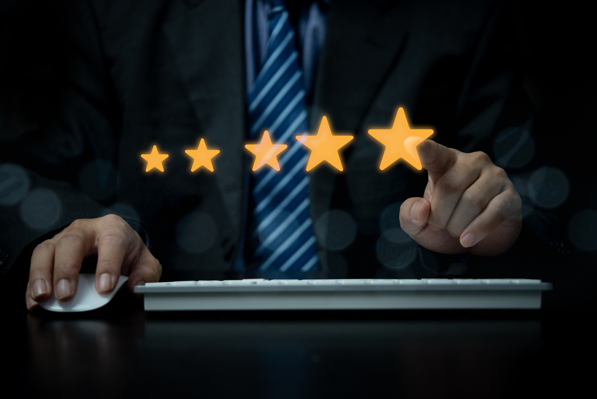 hand using with popup five star icon for feedback review satisfaction service computer, best quality product and service.Customer service experience and business satisfaction survey.